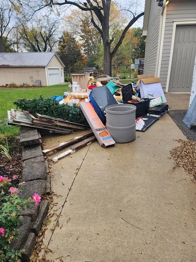 Dumpster being loaded with debris for Commercial Dumpster Rental in Boise City